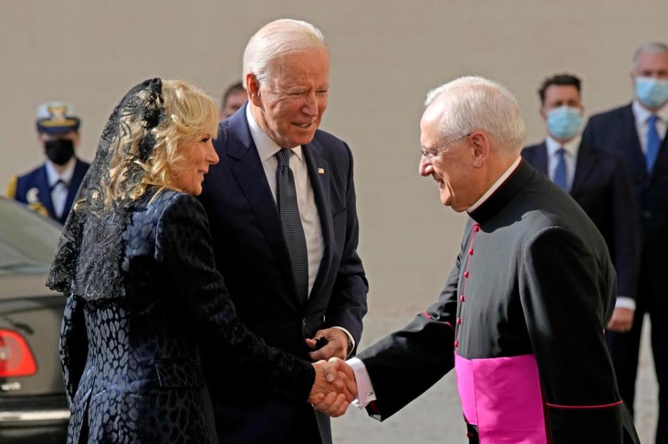 U.S. President Joe Biden and first lady Jill Biden are greeted by Head of the Papal Household, Mons. Leonardo Sapienza, right, as they arrive for a meeting with Pope Francis at the Vatican, Friday, Oct. 29, 2021. (AP)