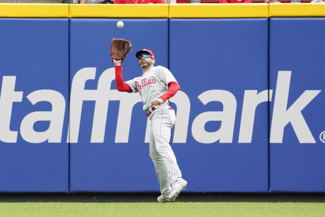 Phillies score 9 in the first to begin their rout of the Reds