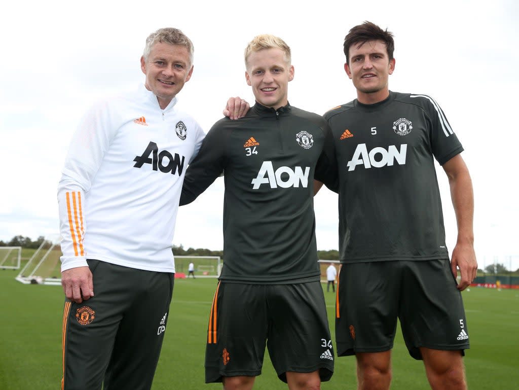 Ole Gunnar Solskjaer poses with Donny van de Beek and Harry Maguire (Getty)