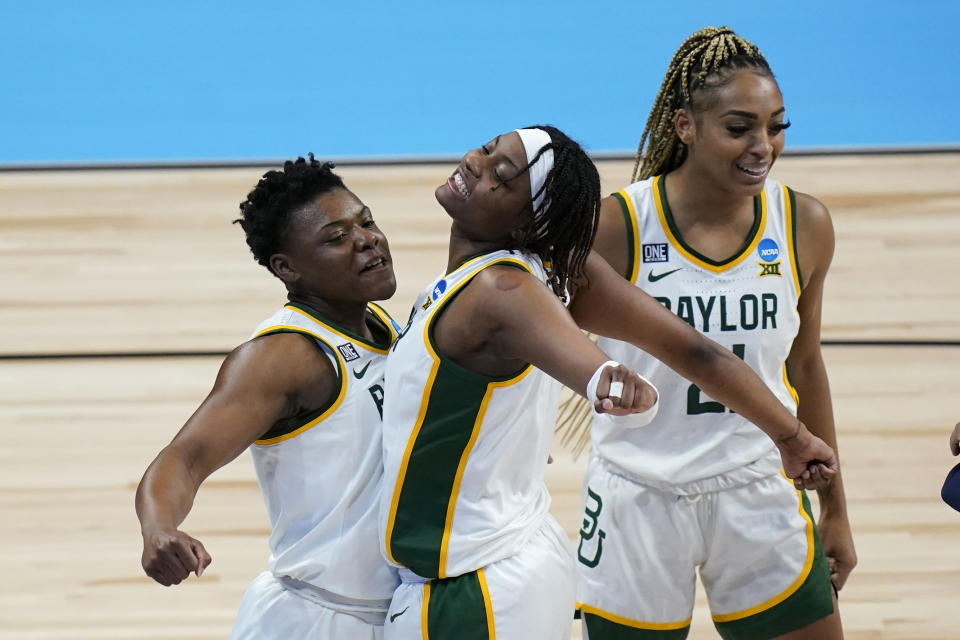 Baylor guard Moon Ursin, left, celebrates with teammate forward NaLyssa Smith during the second half of a college basketball game against Jackson State in the first round of the women's NCAA tournament at the Alamodome, Sunday, March 21, 2021, in San Antonio. (AP Photo/Eric Gay)