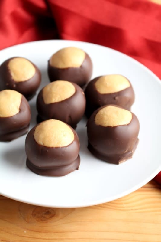 <p>Chocolate with Grace</p><p>Everyone loves chocolate peanut butter balls. Bet you can't eat just one!</p><p><strong>Get the recipe: <a href="https://chocolatewithgrace.com/buckeye-recipe-peanut-butter-balls/" rel="nofollow noopener" target="_blank" data-ylk="slk:Buckeyes;elm:context_link;itc:0;sec:content-canvas" class="link ">Buckeyes</a></strong></p>