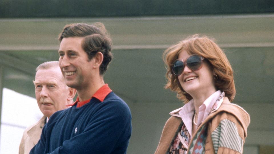 Prince Charles stands next to his then-girlfriend and sister of Lady Diana Spencer, Lady Sarah Spencer