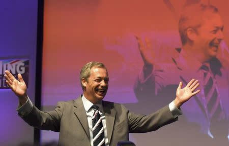 Nigel Farage, the outgoing leader of the United Kingdom Independence Party (UKIP), gestures as he takes to the stage to speak at the party's annual conference in Bournemouth, Britain, September 16, 2016. REUTERS/Toby Melville