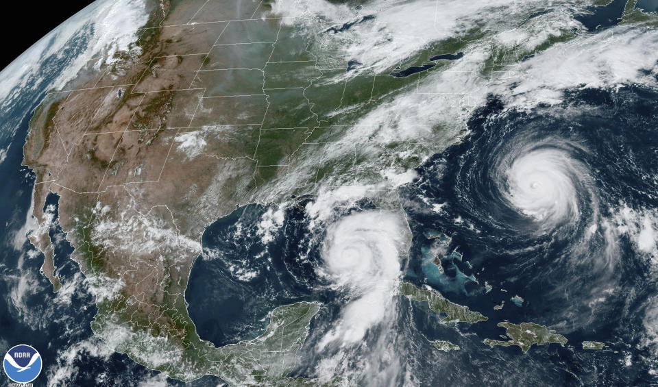 This Tuesday, Aug. 29, 2023, 1:31 p.m. EDT satellite image provided by the National Oceanic and Atmospheric Administration shows Hurricane Idalia, center, approaching Florida's Gulf Coast, and Hurricane Franklin, right, as it moves along the East coast of the United States, southwest of Bermuda. Feeding on some of the hottest water on the planet, Hurricane Idalia is expected to rapidly strengthen as it bears down on Florida and the rest of the Gulf Coast, scientists said. (NOAA via AP)