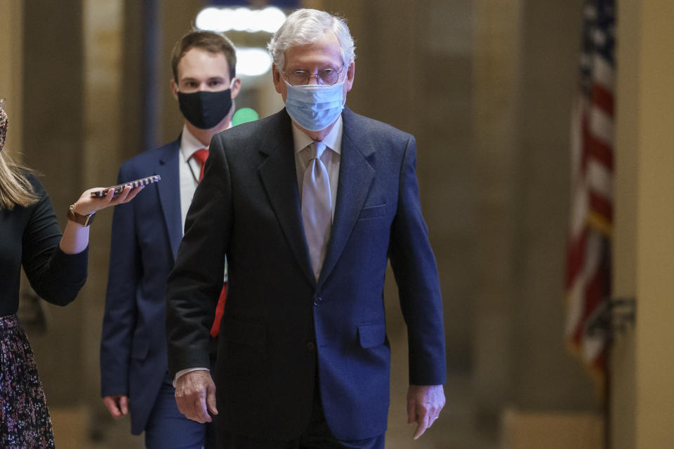 Senate Minority Leader Mitch McConnell, R-Ky., heads to the chamber as the Senate holds the final vote to confirm Xavier Becerra, President Joe Biden's pick to be secretary of Health and Human Services, at the Capitol in Washington, Thursday, March 18, 2021. (AP Photo/J. Scott Applewhite)