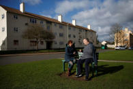 A researcher for "My Country; a work in progress", Sarah Blowers (L) talks with Community volunteer Brendon O'Donnell, as they pose for a photograph on the Matson housing estate, in Gloucester. REUTERS/Peter Nicholls