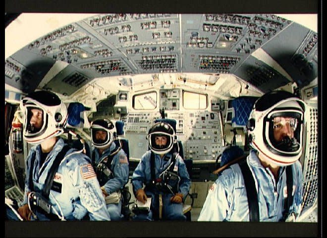 Shuttle Mission Simulator scene of astronauts Michael J. Smith, Ellison S. Onizuka, Judith A. Resnik, and Francis R. (Dick) Scobee in their launch and entry positions on the flight deck. The photo was taken by Bill Bowers. (NASA, Dec. 12, 1985) (<a href="http://history1900s.about.com/od/photographs/ig/Space-Shuttle-Challenger/" target="_hplink">Via About.com</a>)