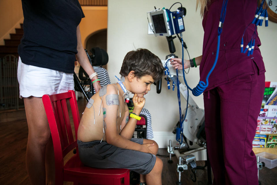 Braden's nurse and mother set him up for treatment. | Ilana Panich-Linsman for TIME