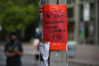 <p>A sign in downtown Toronto reads: "The last residential school closed in 1996." (Steve Russell/Toronto Star via Getty Images)</p> 