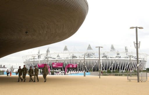 British military personnel walk away from the Olympic Stadium at the 2012 Olympic Park in east London. The head of private security giant G4S admitted the company's failure to provide enough guards for the Olympics was "a humiliating shambles" as he faced a grilling from British lawmakers Tuesday