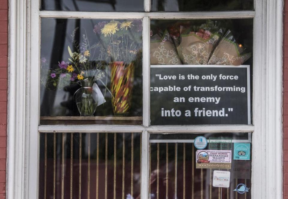 A sign hangs in the window at the Red Hen, a Virginia restaurant where Sarah Sanders was asked to leave during her meal. 