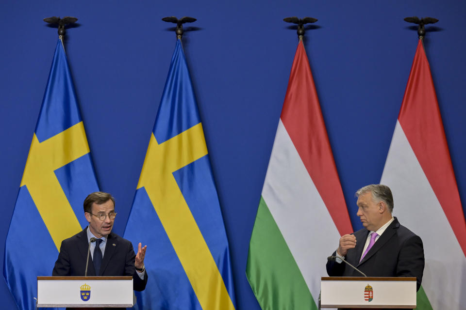 Sweden's Prime Minister Ulf Kristersson, left, speaks during a press conference with his Hungarian counterpart Viktor Orban at the Carmelite Monastery in Budapest, Hungary, Friday, Feb 23, 2024. Nearly two years after Sweden formally applied to join NATO, its membership now hinges on convincing one country - Viktor Orban's Hungary - to formally ratify its bid to join the military alliance. (AP Photo/Denes Erdos)