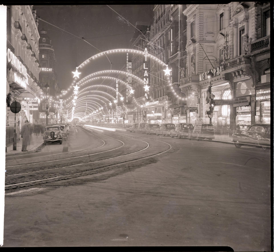 Brussels prepares for its 1949 Christmas display, with millions of colored bulbs decorating the main streets.