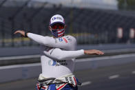 Graham Rahal stretches before a practice session for an IndyCar auto race at Indianapolis Motor Speedway, Thursday, Oct. 1, 2020, in Indianapolis. (AP Photo/Darron Cummings)