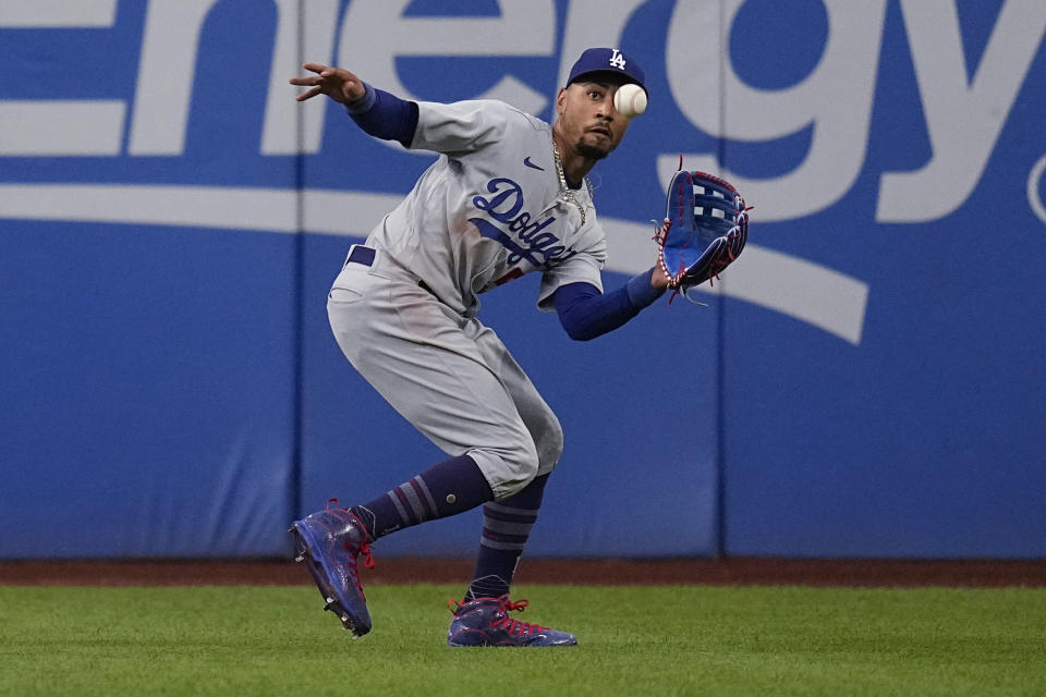 Los Angeles Dodgers right fielder Mookie Betts catches a fly ball hit by Cleveland Guardians' Steven Kwan during the first inning of a baseball game Wednesday, Aug. 23, 2023, in Cleveland. (AP Photo/Sue Ogrocki)