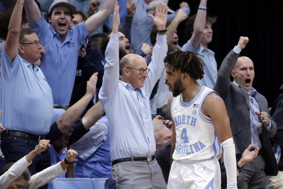 North Carolina guard RJ Davis (4) and the fans celebrate after he shot a three-pointer against Wake Forest during the second half of an NCAA college basketball game, Monday, Jan. 22, 2024, in Chapel Hill, N.C. (AP Photo/Chris Seward)