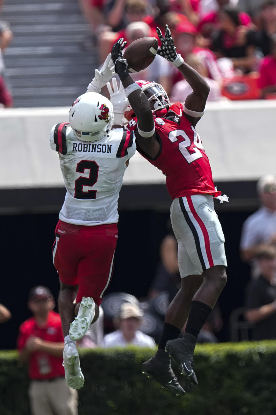 FILE - Georgia defensive back Malaki Starks (24) intercepts as pass intended for Ball State wide receiver Ty Robinson (2) in the first half of an NCAA college football game Saturday, Sept. 9, 2023, in Athens, Ga. Starks has been selected to The Associated Press midseason All-America team, Wednesday, Oct. 18, 2023.(AP Photo/John Bazemore, File)