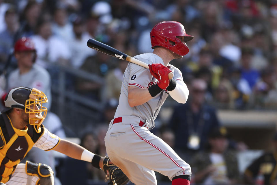 Cincinnati Reds' Tyler Naquin hits an RBI single off San Diego Padres relief pitcher Daniel Camarena in the fifth inning of a baseball game Saturday, June 19, 2021, in San Diego. Jonathan India scored on the play. (AP Photo/Derrick Tuskan)