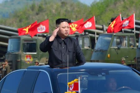 North Korea's leader Kim Jong Un watches a military drill marking the 85th anniversary of the establishment of the Korean People's Army (KPA) in this handout photo by North Korea's Korean Central News Agency (KCNA) made available on April 26, 2017. KCNA/Handout via REUTERS