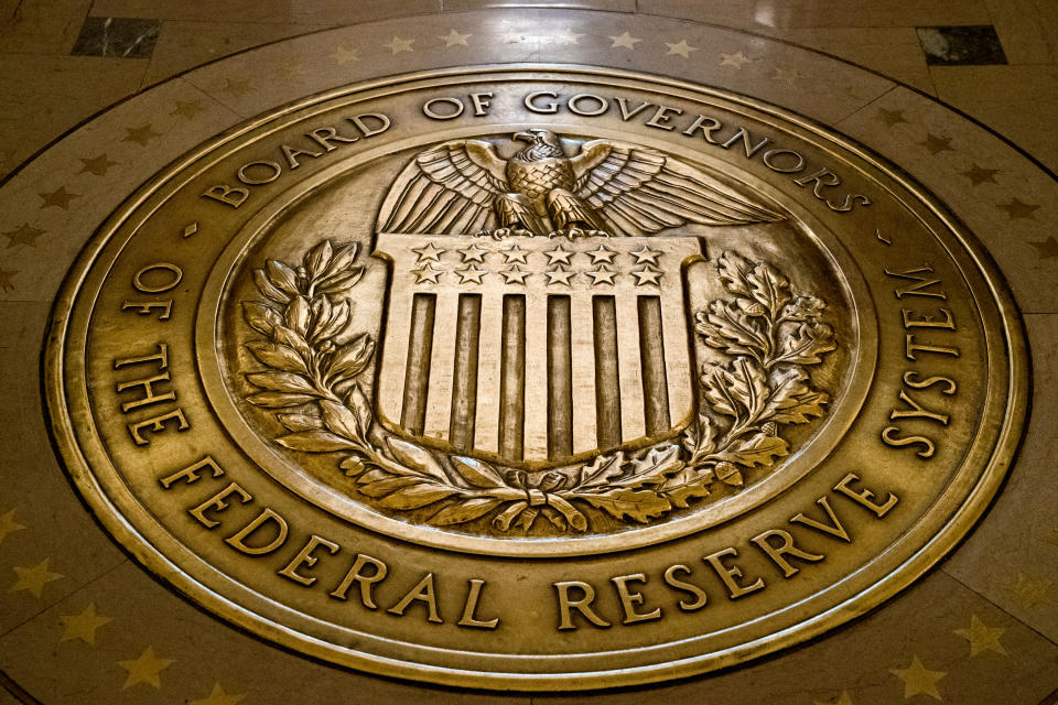 FILE- In this Feb. 5, 2018, file photo, the seal of the Board of Governors of the United States Federal Reserve System is displayed in the ground at the Marriner S. Eccles Federal Reserve Board Building in Washington. On Friday, May 5, 2023 The Associated Press reported on stories circulating online incorrectly claiming the Federal Reserve is launching a new program that will give it the power to monitor, freeze and even seize private bank accounts based on a person’s behavior or political beliefs. (AP Photo/Andrew Harnik, File)