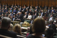 FILE - In this Sept. 7, 2021, file photo, provided by UK Parliament, Britain's Prime Minister Boris Johnson speaks in the House of Commons, London. Britons are encouraged these days — though in most cases not required — to wear face coverings in crowded indoor spaces. But Johnson regularly appears in the packed, poorly ventilated House of Commons cheek-by-jowl with other maskless Conservative lawmakers. (Jessica Taylor/UK Parliament via AP, File)