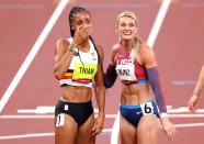 <p>Nafissatou Thiam of Team Belgium reacts after winning the gold medal in the Women's Heptathlon alongside Annie Kunz of Team United States at Olympic Stadium on August 5.</p>