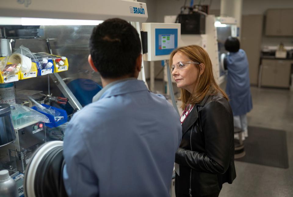 General Motors Chair and CEO Mary Barra listens to researcher Hernando Gonzalez speak about what he does while working in the materials lab at the Research and Development building of the GM Global Technical Center campus in Warren on Tuesday, May 3, 2022, during a photo op following an interview with the Detroit Free Press.