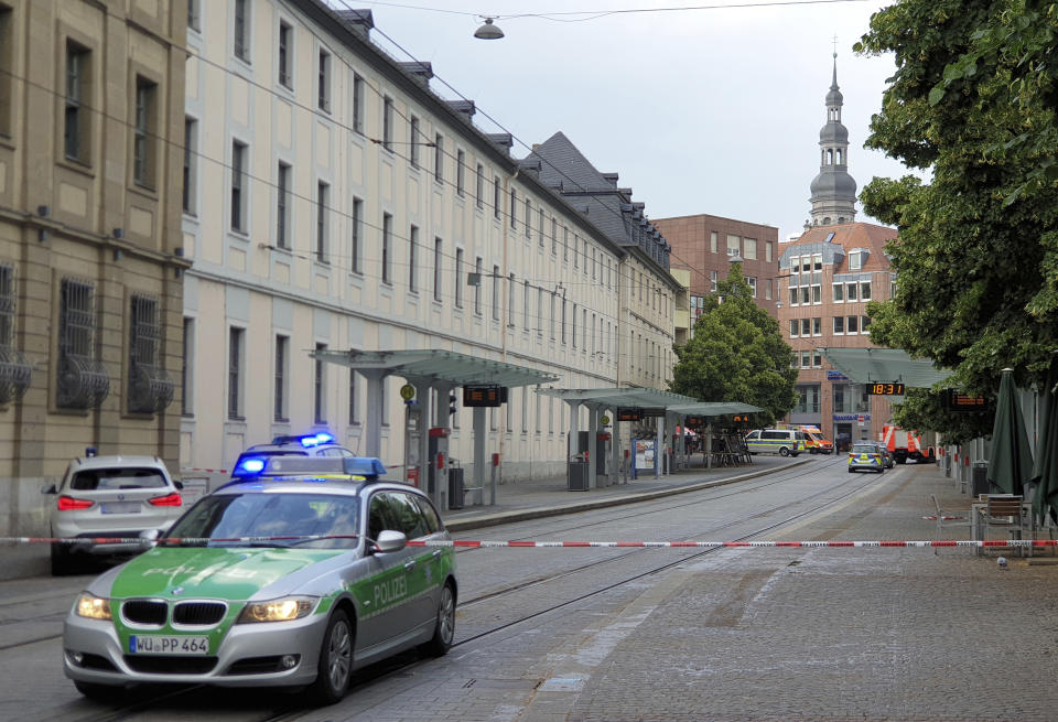 Police cars attend the scene of an incident in Wuerzburg, Germany, Friday June 25, 2021. German police say several people have been injured in an incident in the southern city of Wuerzburg. (Carolin Gi'ibl/dpa via AP)