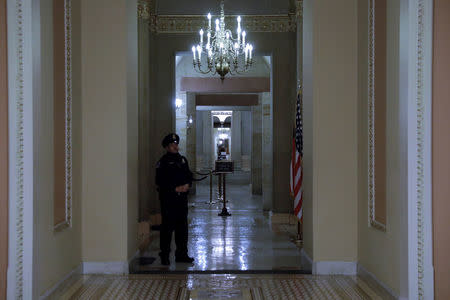 Capitol Police officer stands shortly after beginning the Government shutdown on Capitol Hill in Washington, U.S., January 20, 2018. REUTERS/Yuri Gripas