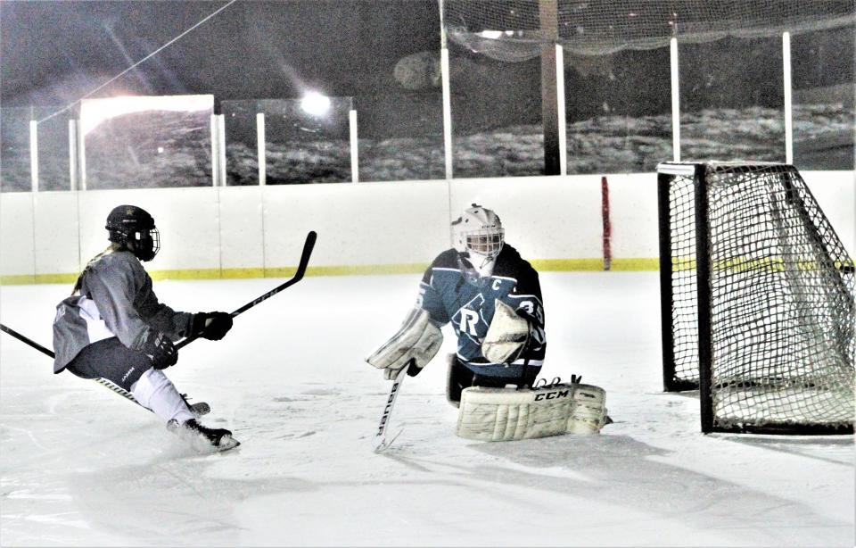 A shot from the East Green Wave's Peyton Wierl hits the back of the net, beating Rockland Rockies goalie Marina Capone. The goal, recorded March 5, 2021 at the outdoor "pond" at the Brewster Ice Arena, was the first in Section 1 girls ice hockey history.