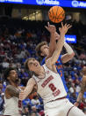 Alabama forward Grant Nelson (2) battles Florida center Micah Handlogten (3) for a rebound during the first half of an NCAA college basketball game at the Southeastern Conference tournament Friday, March 15, 2024, in Nashville, Tenn. (AP Photo/John Bazemore)