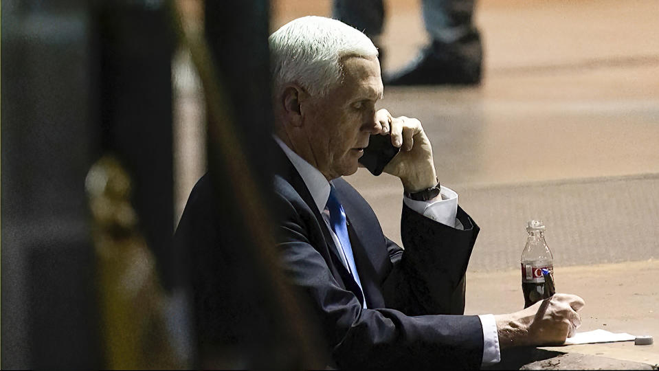 In this image from video released by the House Select Committee, Vice President Mike Pence talks on a phone from his secure evacuation location on Jan. 6 that is displayed as House select committee investigating the Jan. 6 attack on the U.S. Capitol holds a hearing Thursday, June 16, 2022, on Capitol Hill in Washington. (House Select Committee via AP)