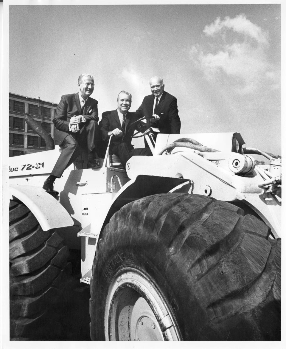 University of Akron President Norman Auburn (from left), Ohio Gov. James A. Rhodes and Edwin J. Thomas are seated on construction equipment at the July 30, 1969, groundbreaking ceremony for E.J. Thomas Performing Arts Hall in Akron.