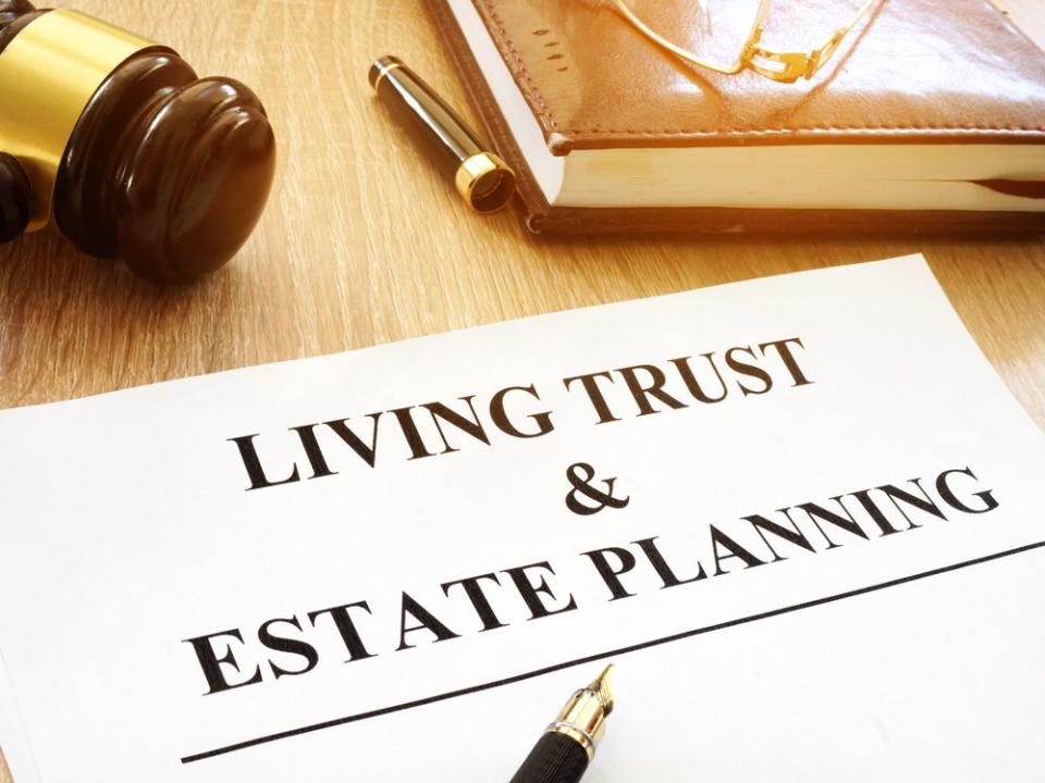 Living trust and estate planning form on a desk.