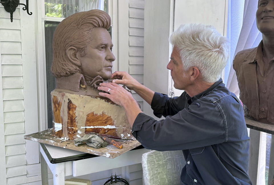 Artist Kevin Kresse, works on a clay bust of Johnny Cash, April 23, 2024 in Little Rock, Ark. Kresse's full sculpture of Cash will be unveiled at the U.S. Capitol as part of the Statuary Hall collection, later this year. (AP Photo/Mike Pesoli)