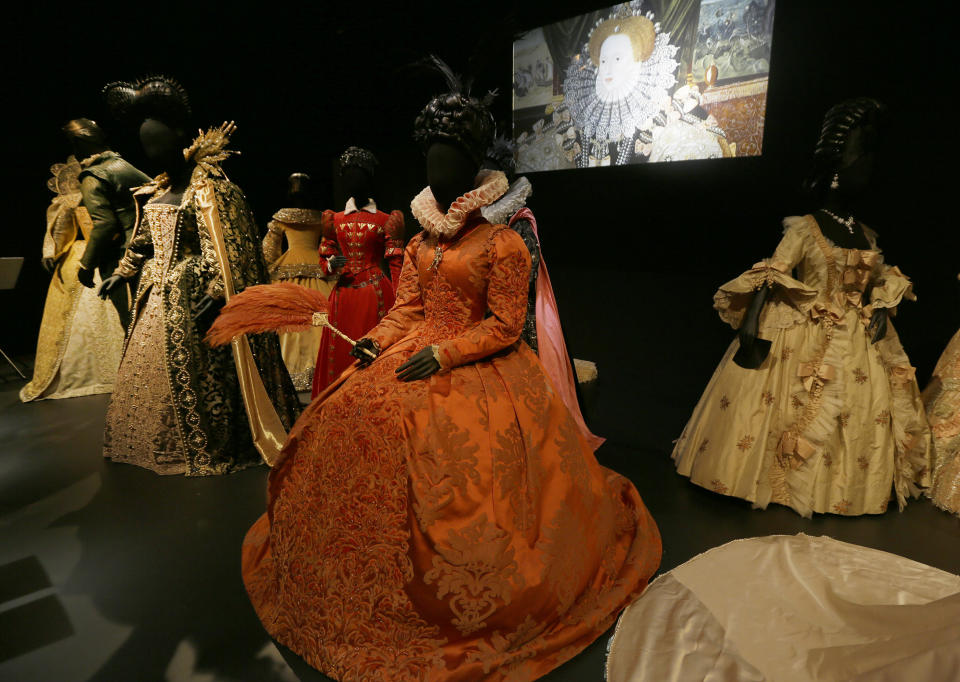 A selection of costumes showing various designs and outfits worn by actress playing royal and regal  characters seen at the Hollywood Costume exhibition at the Victoria and Albert museum in London, Tuesday, Oct. 16, 2012. The show at the Victoria and Albert Museum showcases more than one hundred movie costumes from a century of film-making. The exhibition opens to the public on Oct. 20, 2012 and run till 27 Jan. 2013.(AP Photo/Alastair Grant)