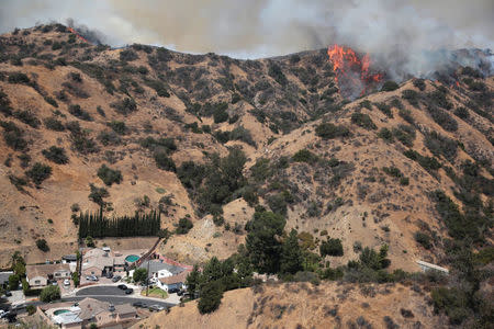 The La Tuna Canyon fire over Burbank, California, September 2, 2017. REUTERS/Kyle Grillot