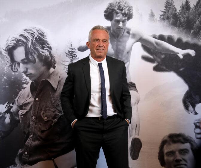 LOS ANGELES, CA - MARCH 30, 2024 - - Independent Presidential Candidate Robert F. Kennedy, Jr., against a mural of images of him as a young man, hosts Cesar Chavez Day to celebrate the life and legacy of Cesar Chavez at the iconic Old Ticket Concourse at Union Station in Los Angeles on March 30, 2024. This event, on Chavez's birthday holiday weekend, included remarks by Robert F. Kennedy, Jr., music by the all-female mariachi group Las Colibri and remarks from Bishop Juan Carlos Mendez. Kennedy Jr. has used Cesar Chavez's name and image in his campaign for president, eliciting outrage from Chavez family members. (Genaro Molina/Los Angeles Times)