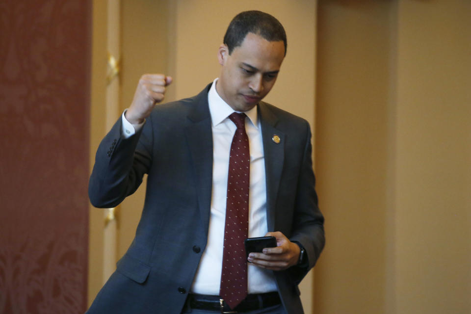 FILE - In this March 4, 2020 file photo Del. Jay Jones, D-Norfolk, reacts to the passage of a bill relating to electric utility at the Capitol in Richmond, Va. Jones sponsored a bill, passed by the Senate, calling for the removal of a statue of former Sen. Harry Byrd, a staunch segregationist, from the Capitol grounds. (AP Photo/Steve Helber)