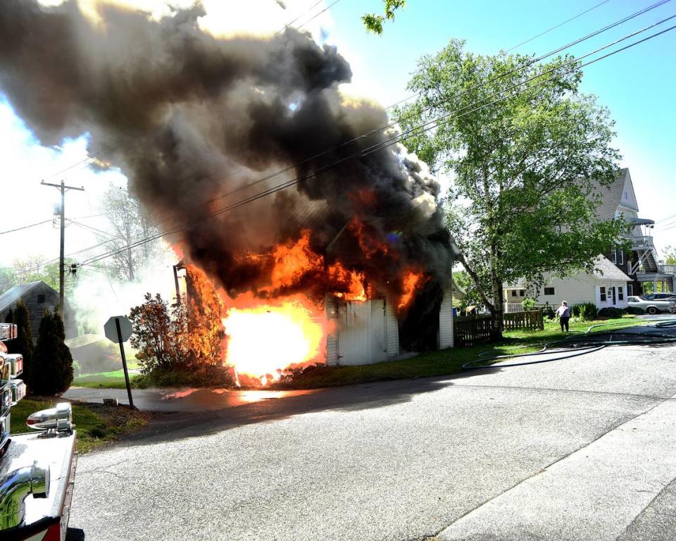 Firefighters wait to start battling a garage fire on East Potter Street due to live wires on Wednesday, May 8, 2024. Mike Frazier/Photo provided