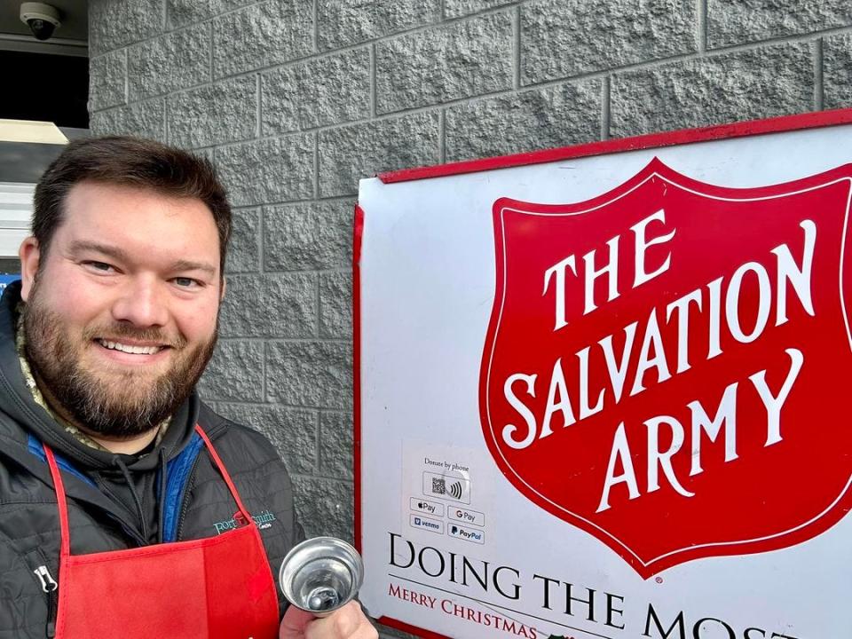 Fort Smith Vice Mayor and board director Jarred Rego rings a bell during the Salvation Army Red Kettle Campaign in Fort Smith at the Walmart Supercenter on Rogers Avenue Wednesday, Dec. 21, 2022. Donations were reportedly down for the holiday campaign.