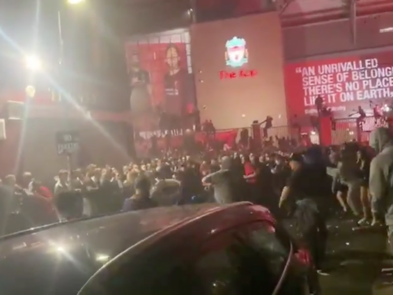 Fans were involved in a mass brawl outside Anfield as Liverpool lifted the Premier League trophy (Twitter/@thatsagoal)