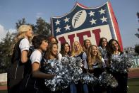 <p>Oakland Raiders cheerleaders pose for photos at an NFL-sponsored event promoting physical activity in Mexico City, Friday, Nov. 18, 2016. The NFL’s Play 60 campaign encourages children to be active 60 minutes a day to avoid childhood obesity. The Raiders play the Houston Texans on Monday. (AP Photo/Rebecca Blackwell) </p>