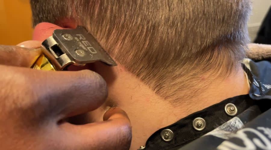 Leathers cutting her client’s hair (Chloe Rafferty/CBS 17)