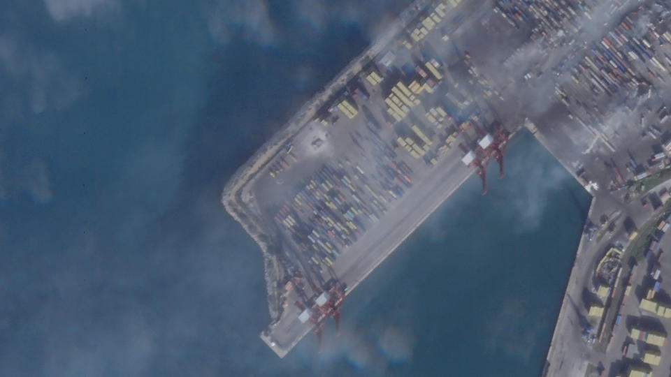 This satellite photograph taken by Planet Labs PBC show the smoldering wreckage after an Israeli strike on the port at Latakia, Syria, Wednesday, Dec. 29, 2021. Firefighters contained a blaze that raged for hours in Syria's port of Latakia on Tuesday, officials said, hours after Israel launched missiles from the Mediterranean Sea, igniting the fire in the container terminal. It was the second such attack on the vital facility this month. (Planet Labs PBC via AP)