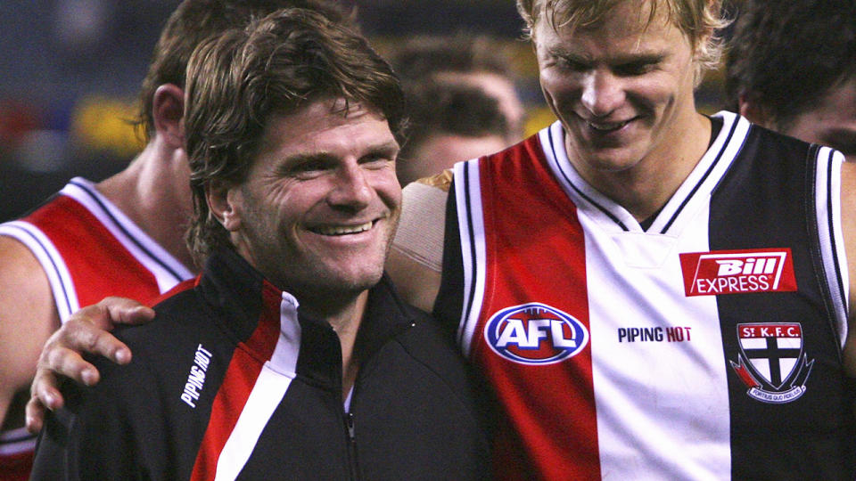 Robert Harvey is pictured with former St Kilda teammate Nick Riewoldt.