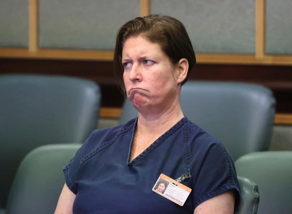 Defendant Sarah Boone listens to her court-appointed attorney Patricia Cashman during a  pre-trial hearing in Orlando, Florida on June 7. Cashman has asked to withdraw from the case (AP)