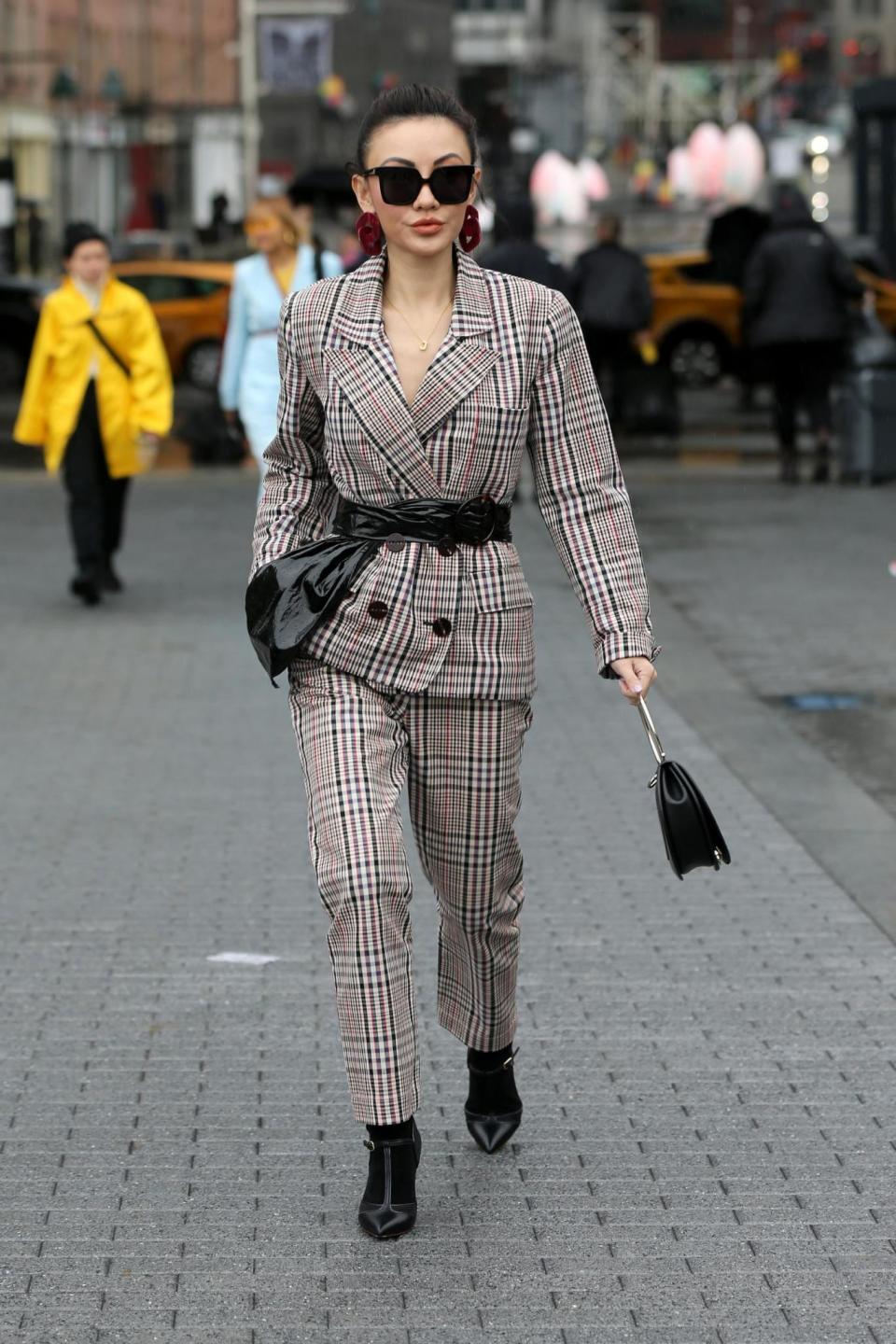 Jessica Wang, wearing an Isa Arfen Blazer and trousers, Malone Souliers boots and Ferragamo bag, NYC February 2018 (Christopher Peterson/Splash News)