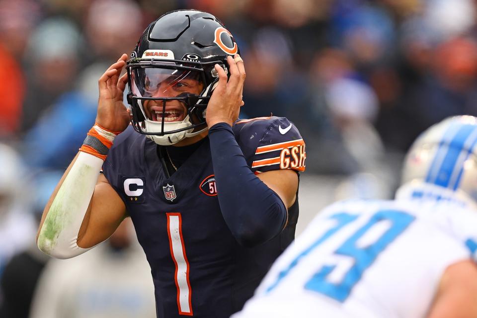 Dec 10, 2023; Chicago, Illinois, USA; Chicago Bears quarterback <a class="link " href="https://sports.yahoo.com/nfl/players/33399" data-i13n="sec:content-canvas;subsec:anchor_text;elm:context_link" data-ylk="slk:Justin Fields;sec:content-canvas;subsec:anchor_text;elm:context_link;itc:0">Justin Fields</a> (1) reacts against the <a class="link " href="https://sports.yahoo.com/nfl/teams/detroit/" data-i13n="sec:content-canvas;subsec:anchor_text;elm:context_link" data-ylk="slk:Detroit Lions;sec:content-canvas;subsec:anchor_text;elm:context_link;itc:0">Detroit Lions</a> during the first half at Soldier Field. Mandatory Credit: Mike Dinovo-USA TODAY Sports