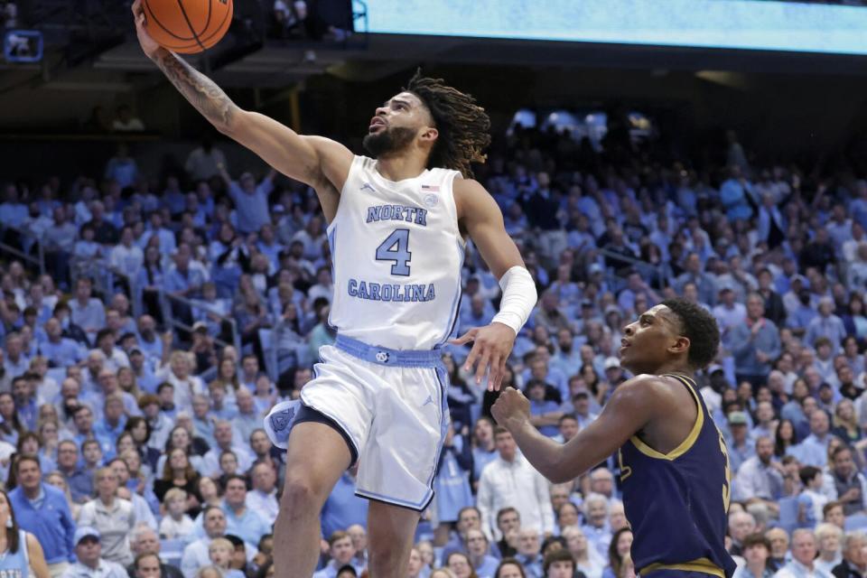 North Carolina guard RJ Davis shoots a layup in front of Notre Dame guard Markus Burton.